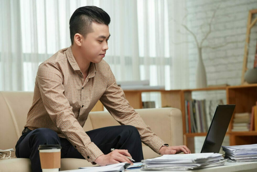 Business person surfing the internet for bilingual website design options.