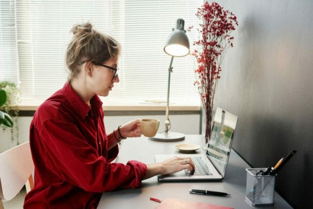 Business women reviewing automated email highlighting a B2B opportunity.