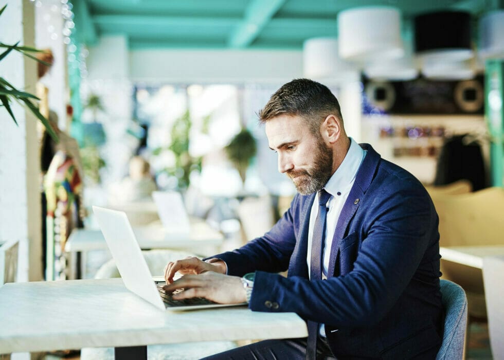 Franchisee owner reviwing protoype website on his laptop.