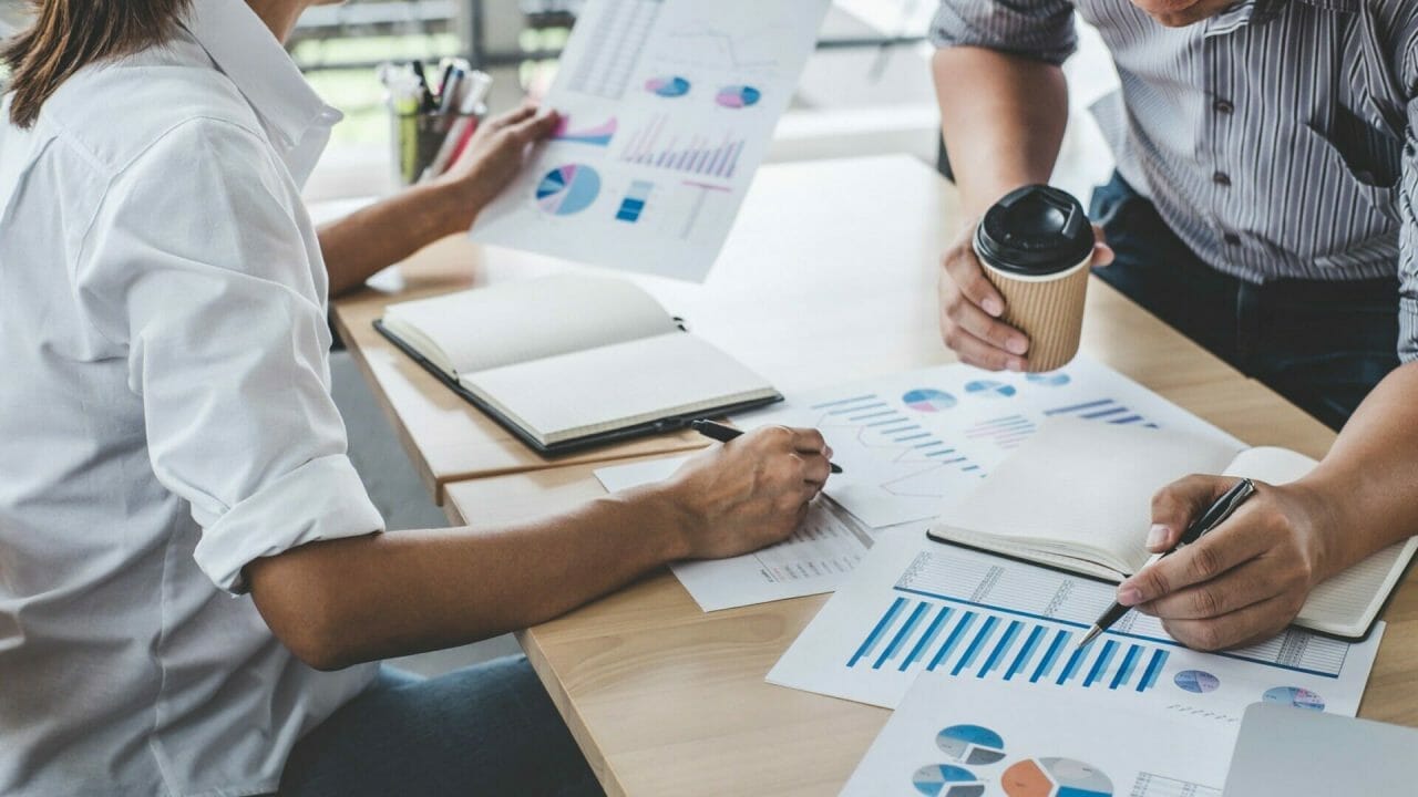 Portrait Of Business Colleagues Reviewing Marketing Data