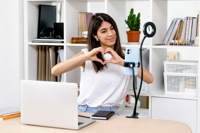 Female influencer recording for social media campaign.