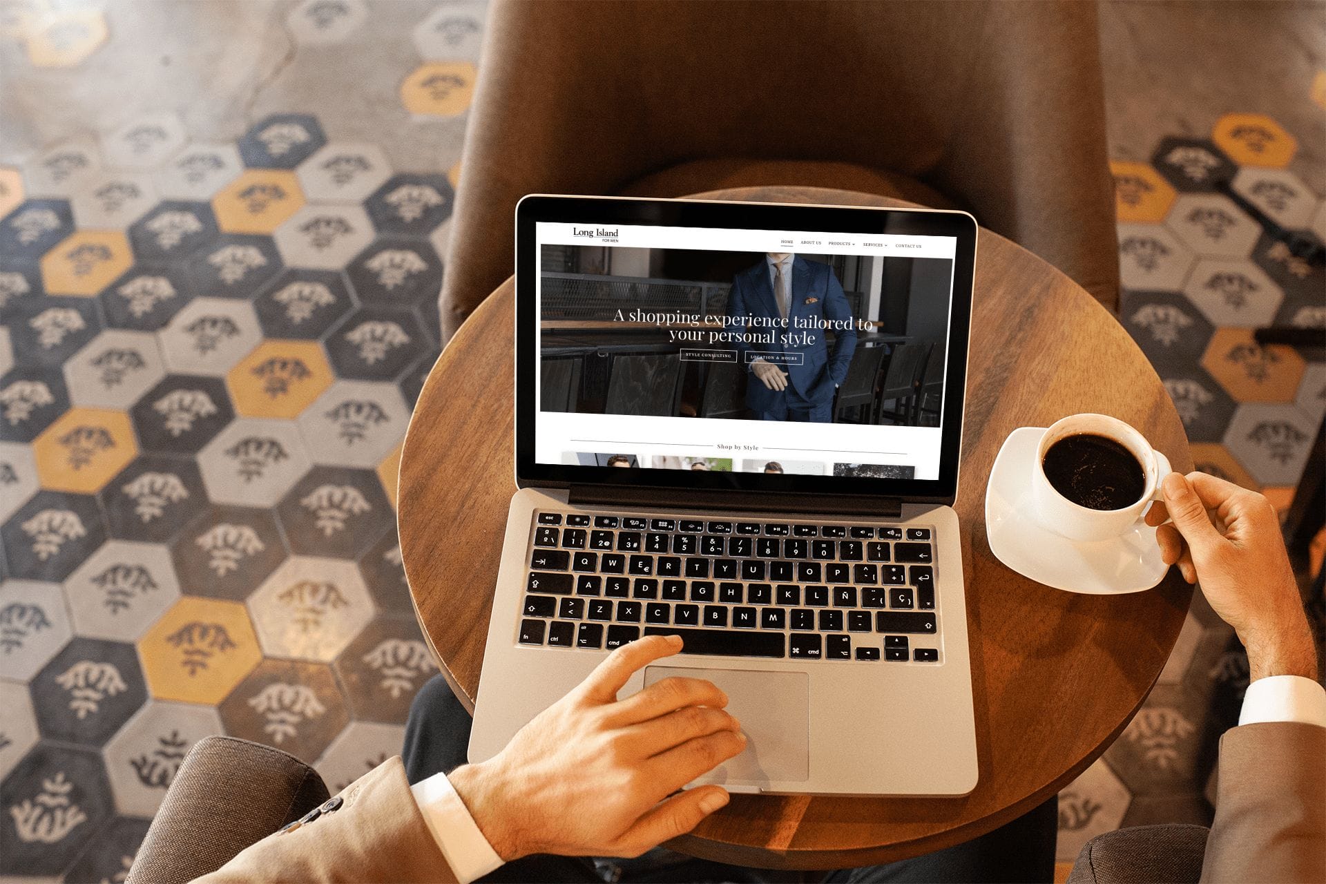 mockup-of-a-businessman-using-a-macbook-at-a-cafe-20990 Long Island Clothiers website desktop view.